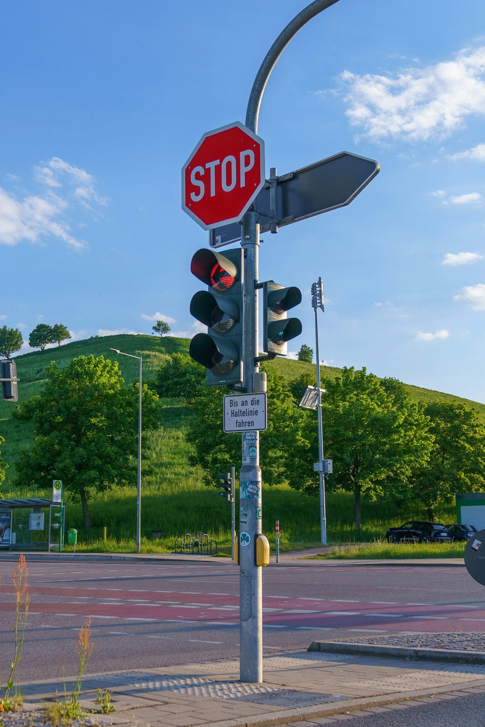 a stop sign and a traffic light at an intersection